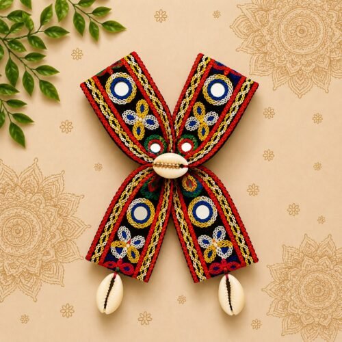 Handmade black mirror-work embroidered hair bow with cowrie shell tassels