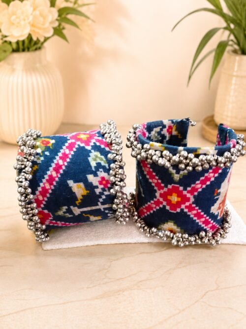 Navy ikat print fabric cuffs with dense silver ghungroo bell trim