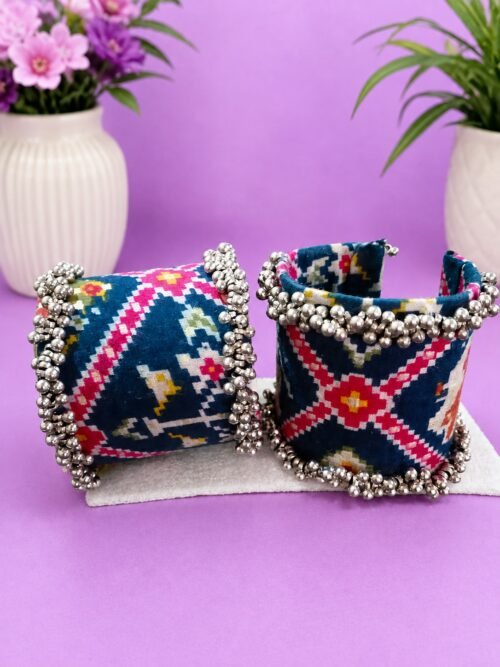 Ikat print cuffs styled with ceramic vases