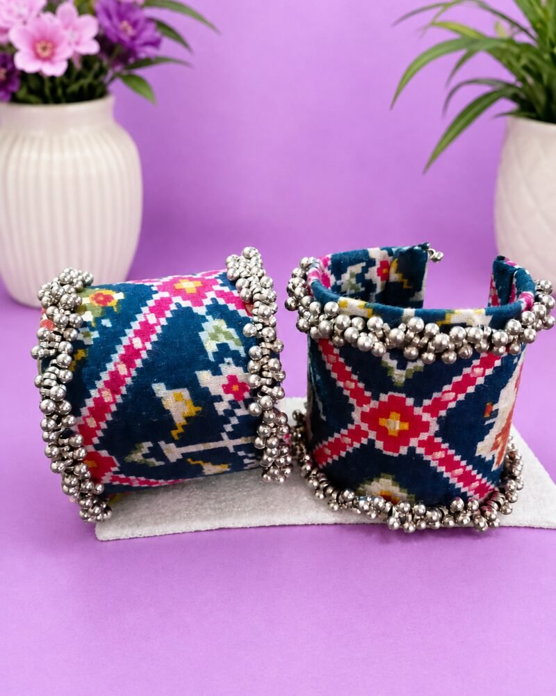 Ikat print cuffs styled with ceramic vases