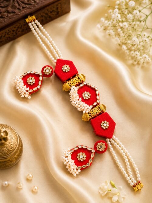 Red kundan and pearl bridal necklace with matching jhumka earrings