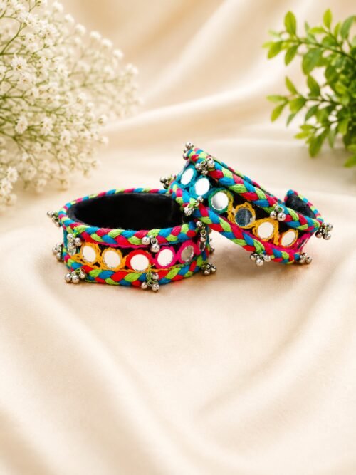 Braided multicolour thread cuffs with round mirror work and silver bell trim